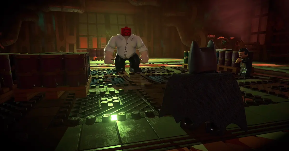 Batman realizando un contraataque a un matón callejero en LEGO Batman Legacy of the Dark Knight