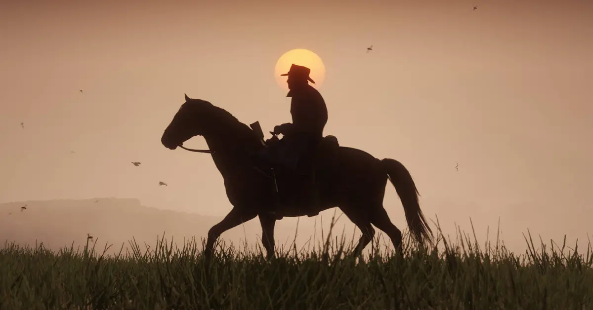 Arthur Morgan a caballo durante un atardecer en Red Dead Redemption 2.